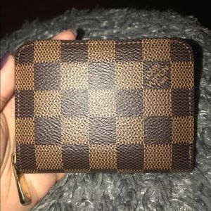 Louis Vuitton mini coin purse.